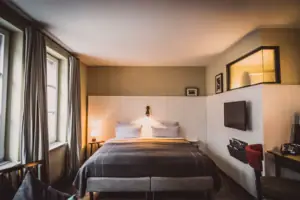 Bed in a stylishly furnished room.