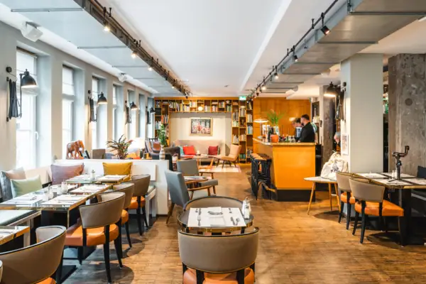 Lounge area with tables and chairs.