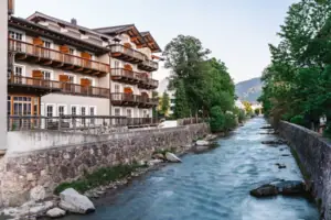 A river with a building and trees.