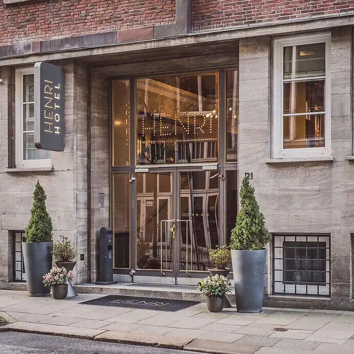 A building with glass doors and a sign.
