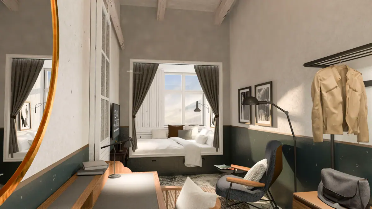 Interior view of a hotel room at the HENRI Hotel Cuxhaven with a bed, table and chairs.