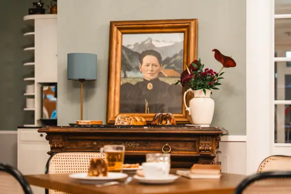 A painting of a woman on a table