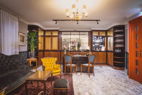 A room with a table and chairs.