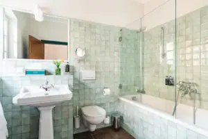 Bathroom with glass-door shower and washbasin